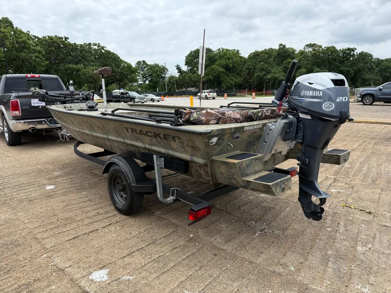 Slide: The Image of 2017 Tracker Grizzly 1654 MVX Sportsman boat with Yamaha motor on trailer in parking lot. - 4