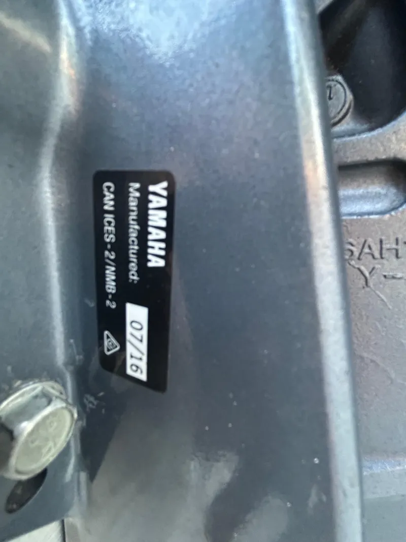 Slide: The Image of Close-up of a Yamaha engine label on a 2017 Tracker Grizzly 1654 MVX Sportsman. - 49