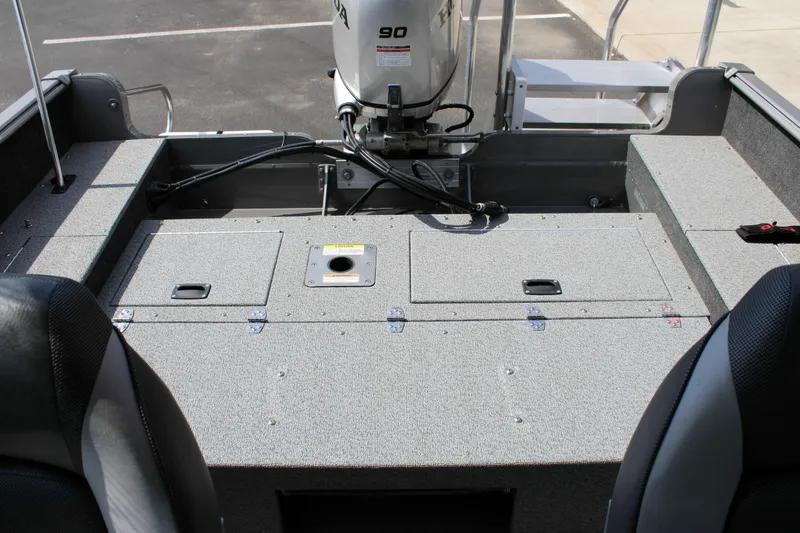 Slide: The Image of 2013 Lund 1675 Impact Sport boat interior with Honda 90 engine. - 11