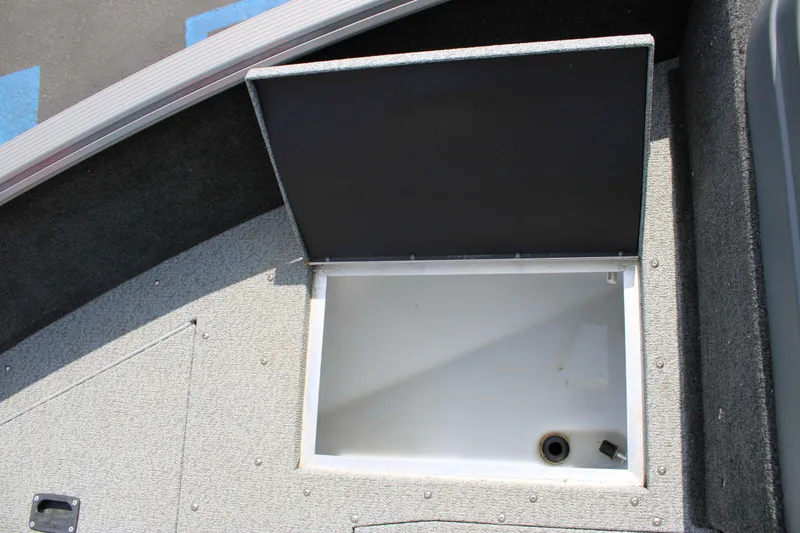 Slide: The Image of Open storage compartment in 2013 Lund 1675 Impact Sport boat. - 15