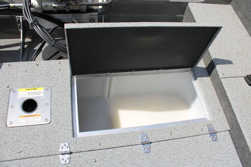 Slide: The Image of Open storage compartment in 2013 Lund 1675 Impact Sport boat. - 18
