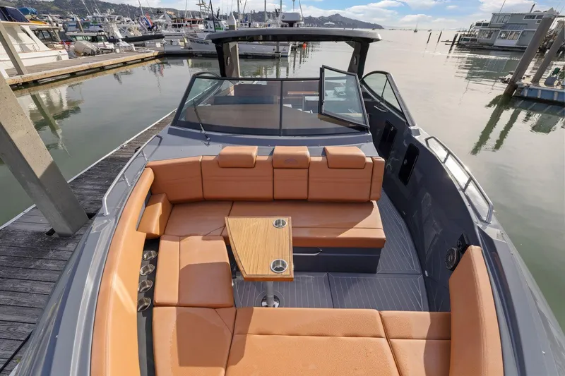 Slide: The Image of 2022 Cruisers Yachts 38 GLS South Beach IO with spacious seating at a marina. - 31