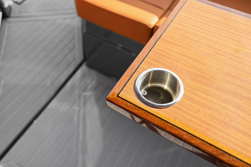 Slide: The Image of Wooden table with cup holder on 2022 Cruisers Yachts 38 GLS South Beach IO. - 33