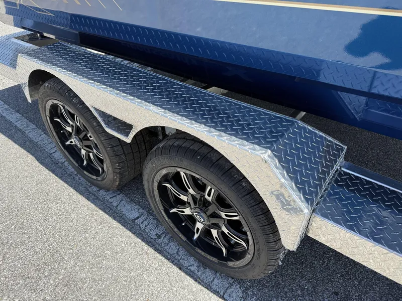 Slide: The Image of Trailer with dual black alloy wheels for 2025 Xpress Hyper-Lift Bay Series H24 BAY. - 3