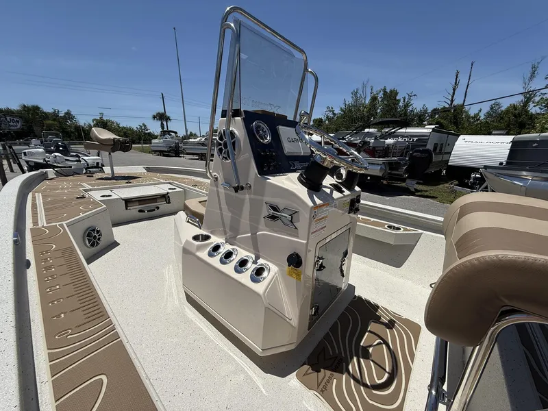 Slide: The Image of 2025 Xpress Hyper-Lift Bay Series H24 BAY boat interior with console and seating. - 6