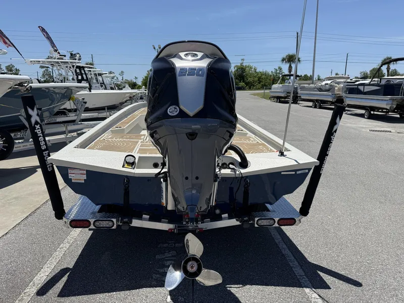 Slide: The Image of 2025 Xpress Hyper-Lift Bay Series H24 BAY boat with powerful outboard motor. - 8