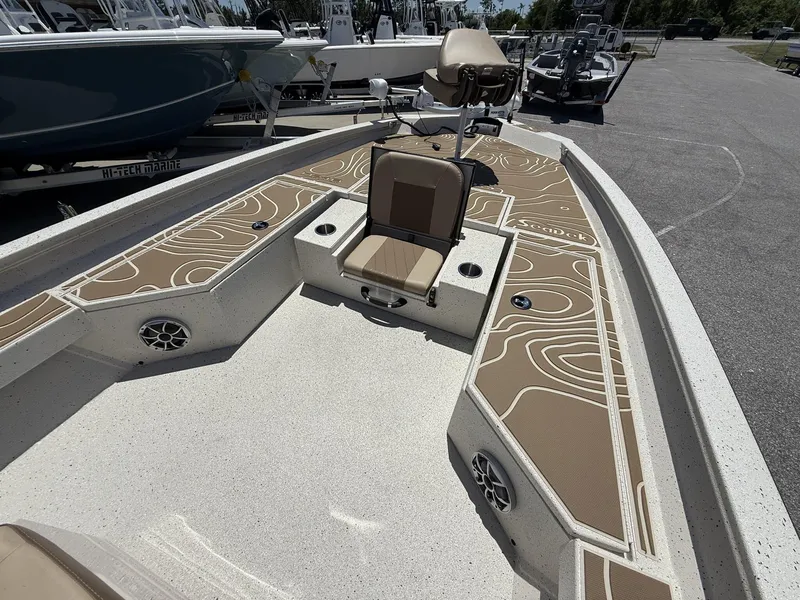 Slide: The Image of 2025 Xpress Hyper-Lift Bay Series H24 BAY boat interior with stylish seating and deck design. - 9