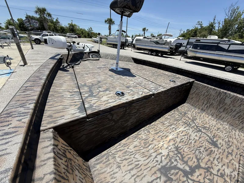 Slide: The Image of 2025 Xpress Hyper-Lift H190 Bay Series boat with camouflage design in a marina setting. - 8