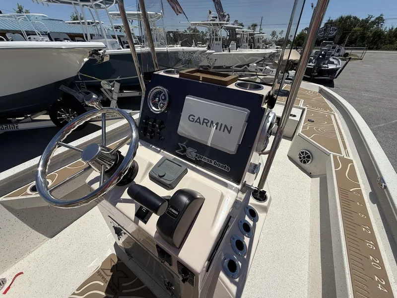 Slide: The Image of 2025 Xpress Hyper-Lift Bay Series H24 BAY boat dashboard with Garmin navigation system. - 4