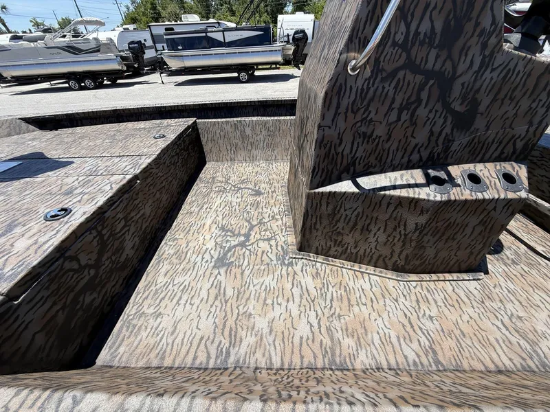 Slide: The Image of 2025 Xpress Hyper-Lift H190 Bay Series boat interior with camouflage pattern. - 9