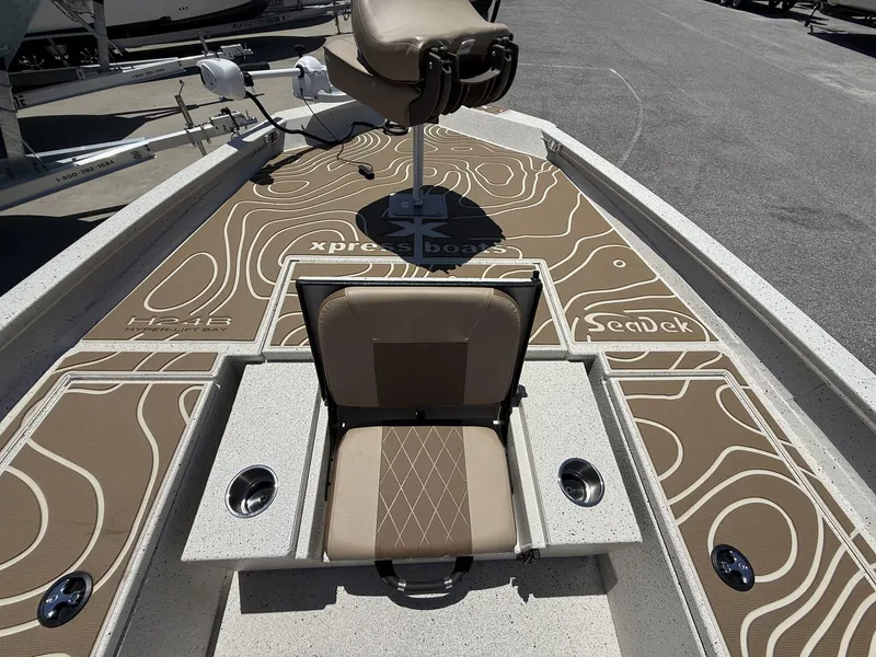 Slide: The Image of 2025 Xpress Hyper-Lift Bay Series H24 BAY boat interior with SeaDek flooring. - 10