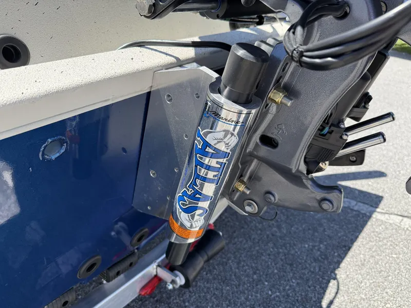 Slide: The Image of 2025 Xpress Hyper-Lift Bay Series H24 BAY boat motor detail with hydraulic steering. - 12