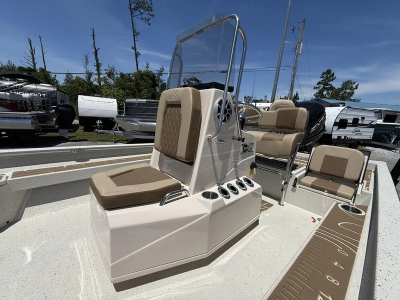 Slide: The Image of 2025 Xpress Hyper-Lift Bay Series H24 BAY boat interior with seating and console. - 5