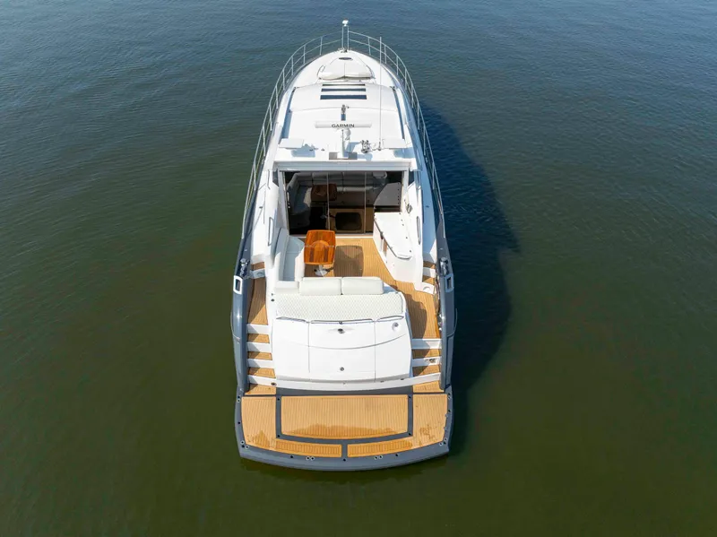 Slide: The Image of 2009 Sunseeker Predator 62 yacht on calm water, aerial view. - 11