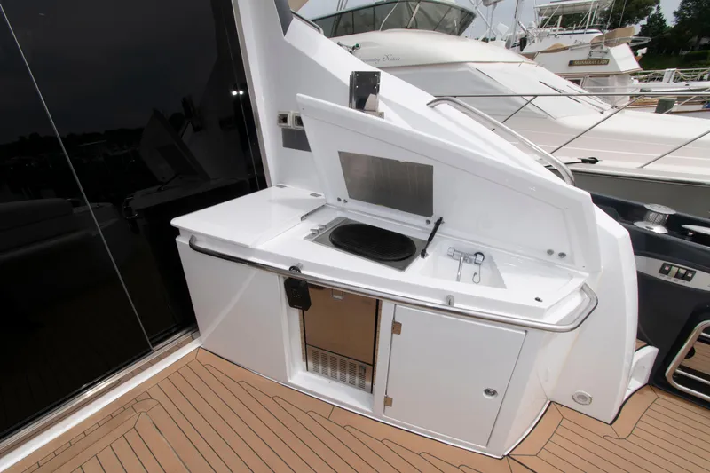 Slide: The Image of Outdoor kitchenette on 2009 Sunseeker Predator 62 yacht with grill and storage. - 23
