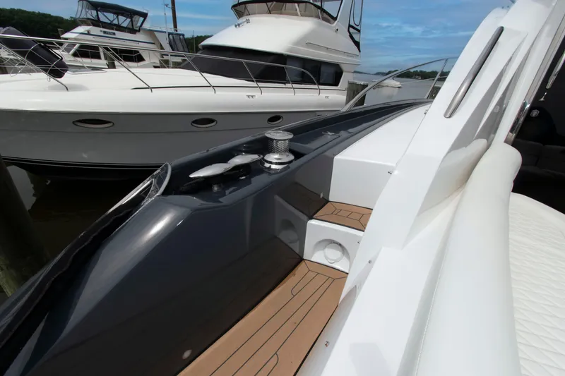 Slide: The Image of 2009 Sunseeker Predator 62 yacht deck with sleek design and modern features. - 24
