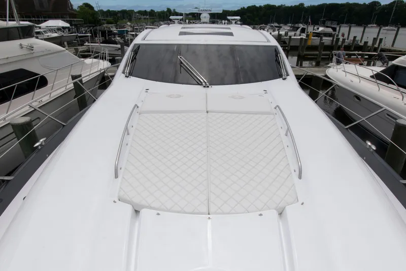 Slide: The Image of 2009 Sunseeker Predator 62 yacht docked at marina, showcasing sleek design and luxury features. - 27