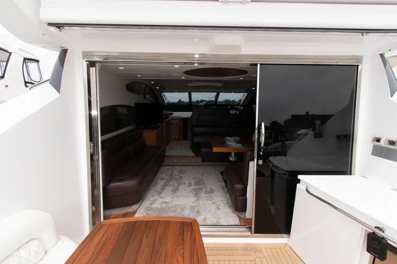 Slide: The Image of Interior view of 2009 Sunseeker Predator 62 yacht, featuring luxurious seating and modern design. - 32