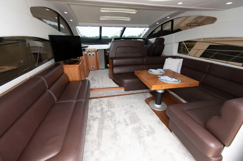 Slide: The Image of Luxurious interior of 2009 Sunseeker Predator 62 yacht with leather seating and dining area. - 33