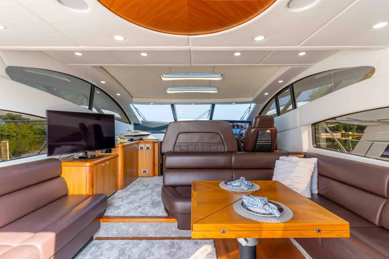 Slide: The Image of Luxurious interior of 2009 Sunseeker Predator 62 yacht with leather seating and wooden accents. - 37