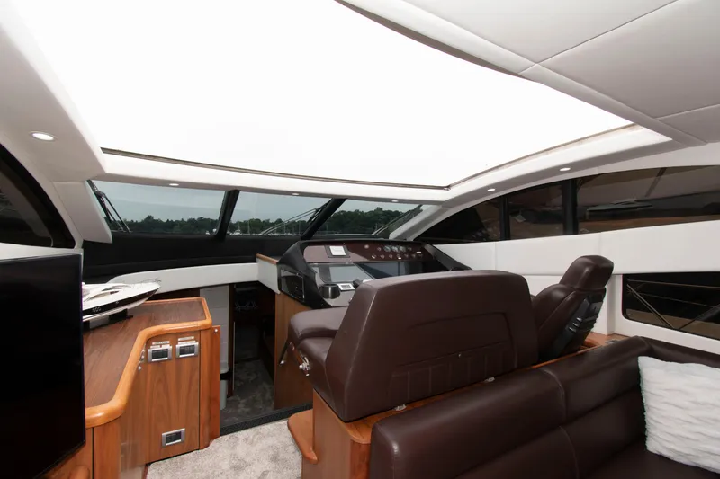 Slide: The Image of Interior of 2009 Sunseeker Predator 62 yacht with modern helm and luxurious seating. - 38