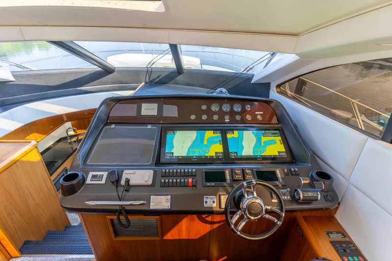 Slide: The Image of Helm of 2009 Sunseeker Predator 62 yacht with navigation screens and controls. - 39