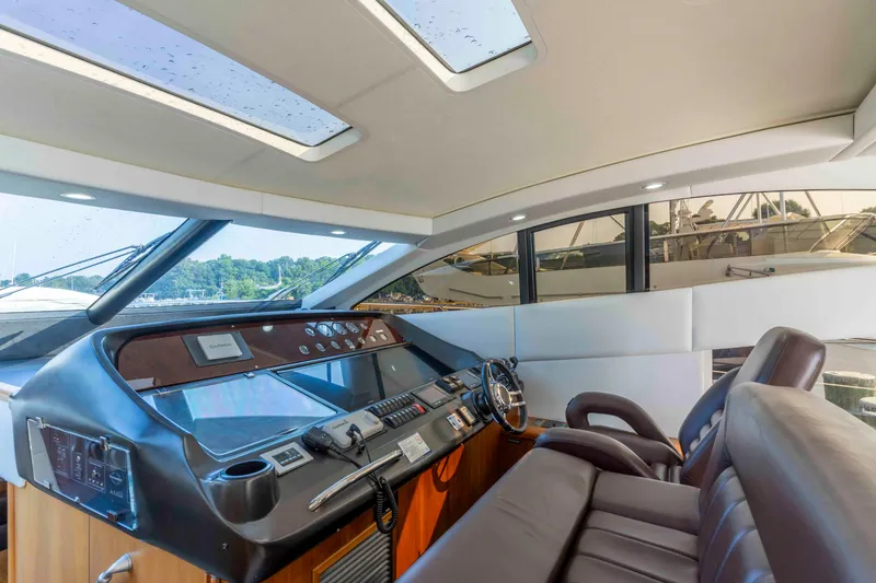 Slide: The Image of Luxurious interior of 2009 Sunseeker Predator 62 yacht with modern helm and seating. - 41