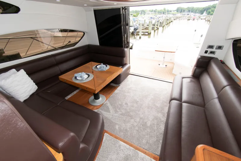 Slide: The Image of Luxurious interior of 2009 Sunseeker Predator 62 yacht with elegant seating and dining area. - 45