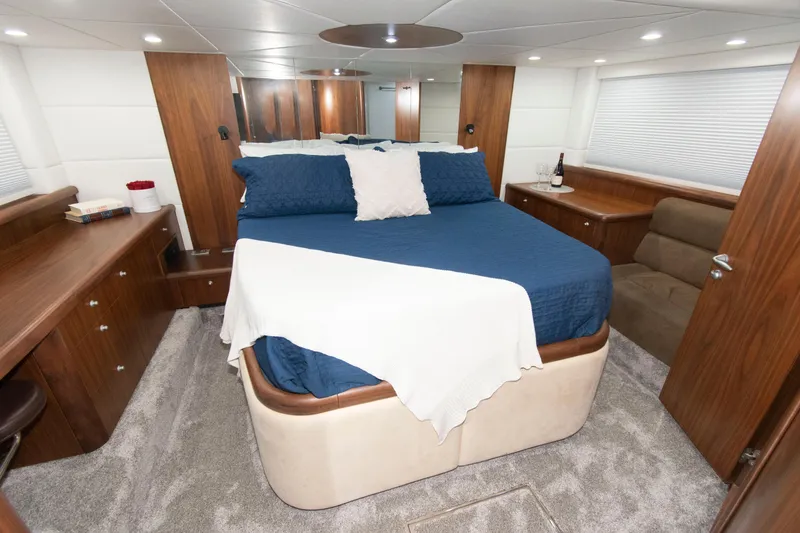 Slide: The Image of Luxurious bedroom interior of 2009 Sunseeker Predator 62 yacht with elegant furnishings. - 53