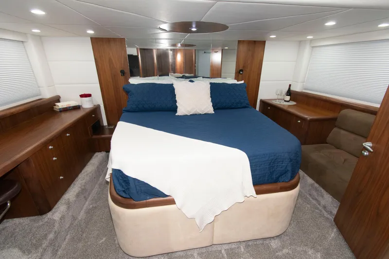 Slide: The Image of Luxurious bedroom interior of 2009 Sunseeker Predator 62 yacht with elegant furnishings. - 54