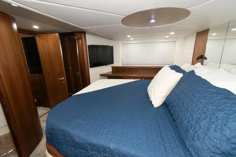 Slide: The Image of Luxurious bedroom interior of 2009 Sunseeker Predator 62 yacht with blue bedding. - 56