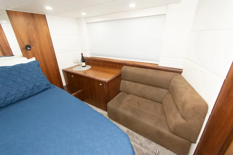 Slide: The Image of Luxurious cabin interior of 2009 Sunseeker Predator 62 yacht with bed and seating area. - 59