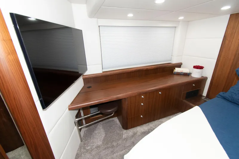 Slide: The Image of Interior of 2009 Sunseeker Predator 62 yacht with modern wood desk and flat-screen TV. - 60
