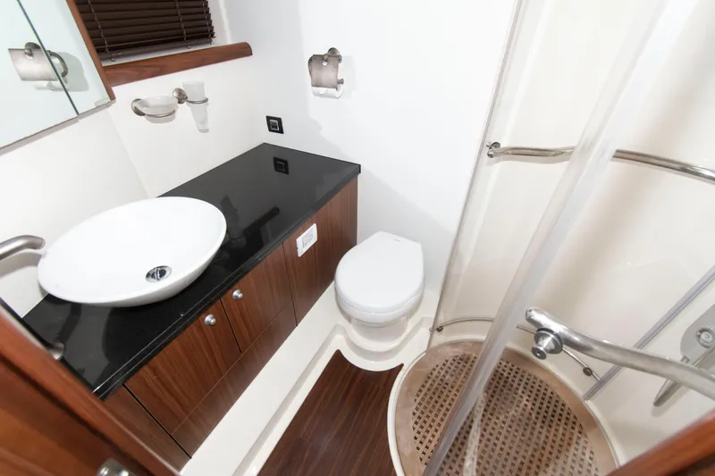 Slide: The Image of Luxurious bathroom in 2009 Sunseeker Predator 62 yacht with modern fixtures and elegant design. - 61