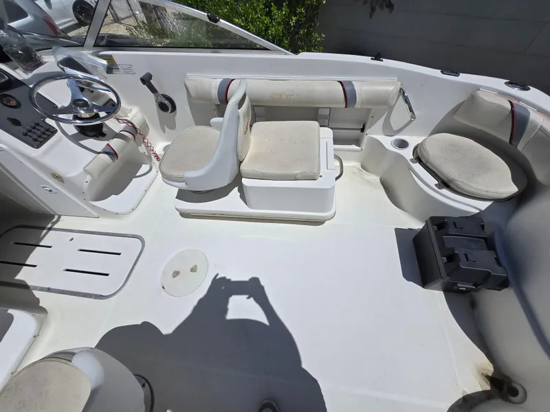 Slide: The Image of 2002 Wellcraft 180 Sportsman boat interior with seating and steering wheel. - 10