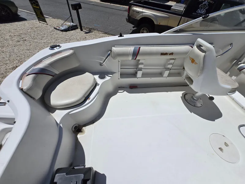 Slide: The Image of 2002 Wellcraft 180 Sportsman boat interior with seating and steering area. - 12