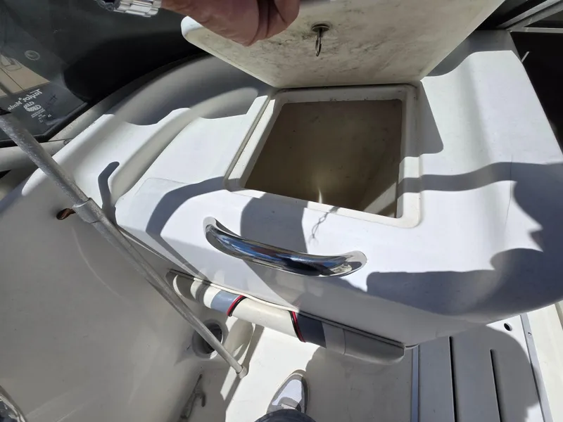 Slide: The Image of 2002 Wellcraft 180 Sportsman boat interior with open storage compartment. - 15