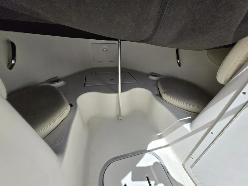 Slide: The Image of Interior of a 2002 Wellcraft 180 Sportsman boat, featuring seating and storage compartments. - 21