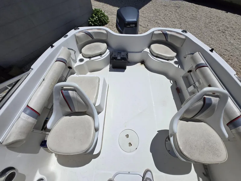 Slide: The Image of 2002 Wellcraft 180 Sportsman boat interior with seating and motor, viewed from above. - 3