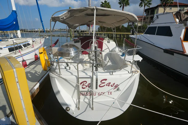 Slide: The Image of 1987 O'Day 322 sailboat docked, featuring "Be Easy" name, Nassau Bay, TX. - 1