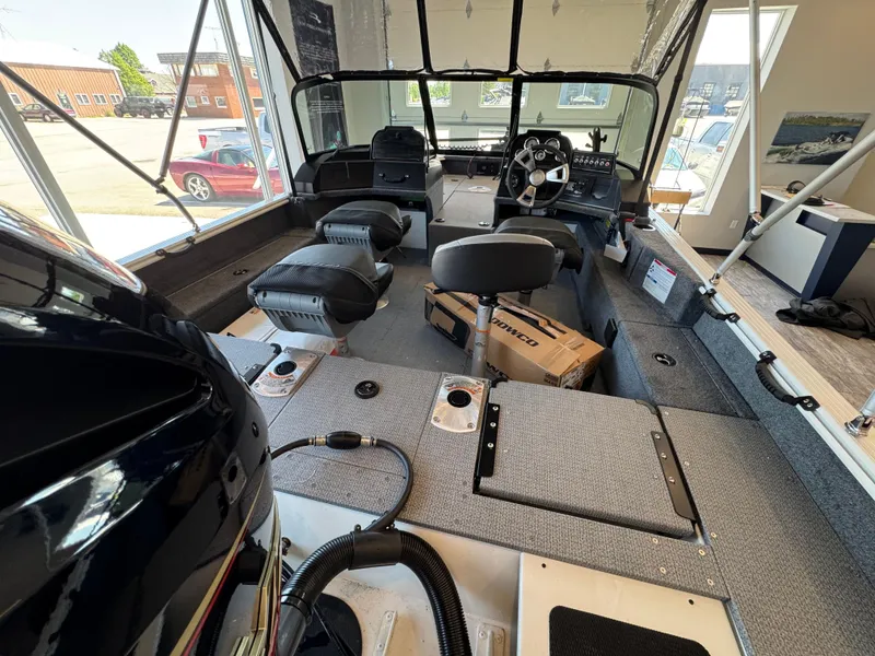 Slide: The Image of Interior of a 2025 G3 AV17SF boat with seating and steering console. - 13