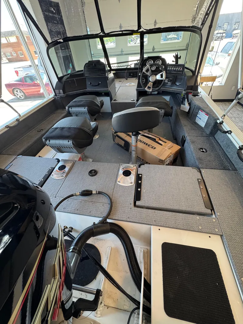 Slide: The Image of Interior of a 2025 G3 AV17SF boat with seating and control panel. - 14