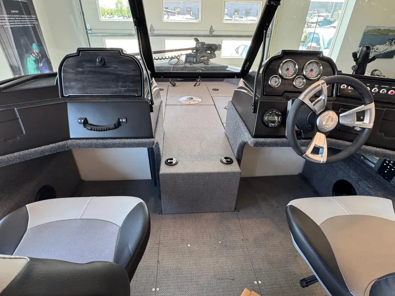 Slide: The Image of Interior of a 2025 G3 AV17SF boat, featuring steering wheel and dashboard controls. - 16