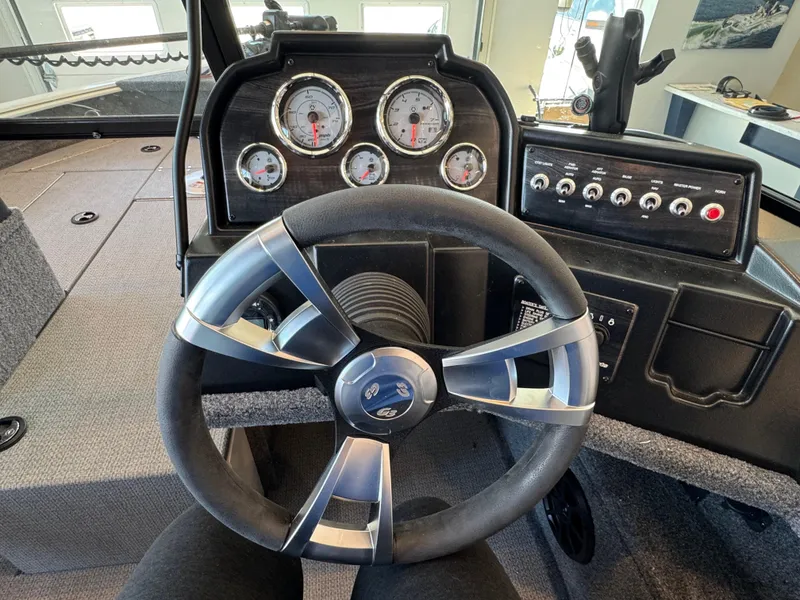 Slide: The Image of Steering wheel and dashboard of 2025 G3 AV17SF boat with gauges and controls. - 19