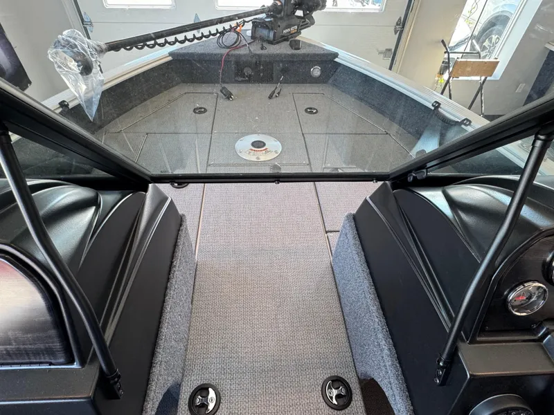 Slide: The Image of Interior view of a 2025 G3 AV17SF boat, featuring a spacious deck and modern controls. - 24