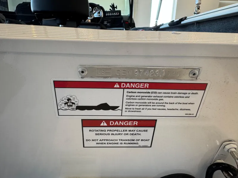 Slide: The Image of Warning labels on a 2025 G3 AV17SF boat, cautioning about carbon monoxide and propeller hazards. - 25
