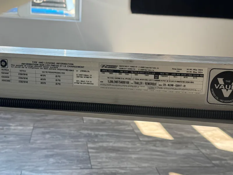 Slide: The Image of Label on a G3 AV17SF 2025 trailer showing tire and loading information. - 26