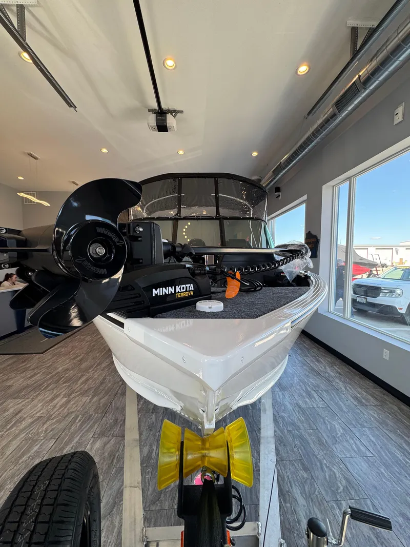 Slide: The Image of 2025 G3 AV17SF boat with Minn Kota Terrova motor displayed indoors. - 5