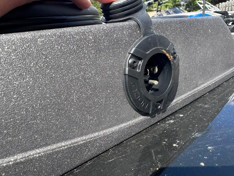 Slide: The Image of 2022 Tracker V-18 Targa boat detail showing a black socket on a textured surface. - 12