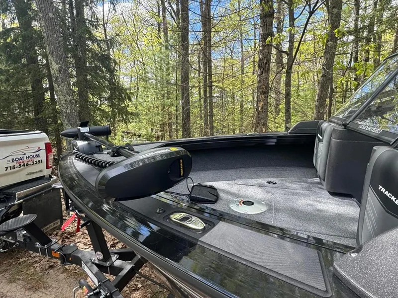 Slide: The Image of 2022 Tracker V-18 Targa boat on trailer in wooded area. - 5